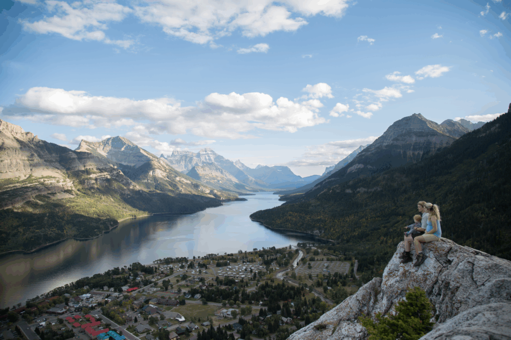 family sits on top of bears hump in waterton lakes national park