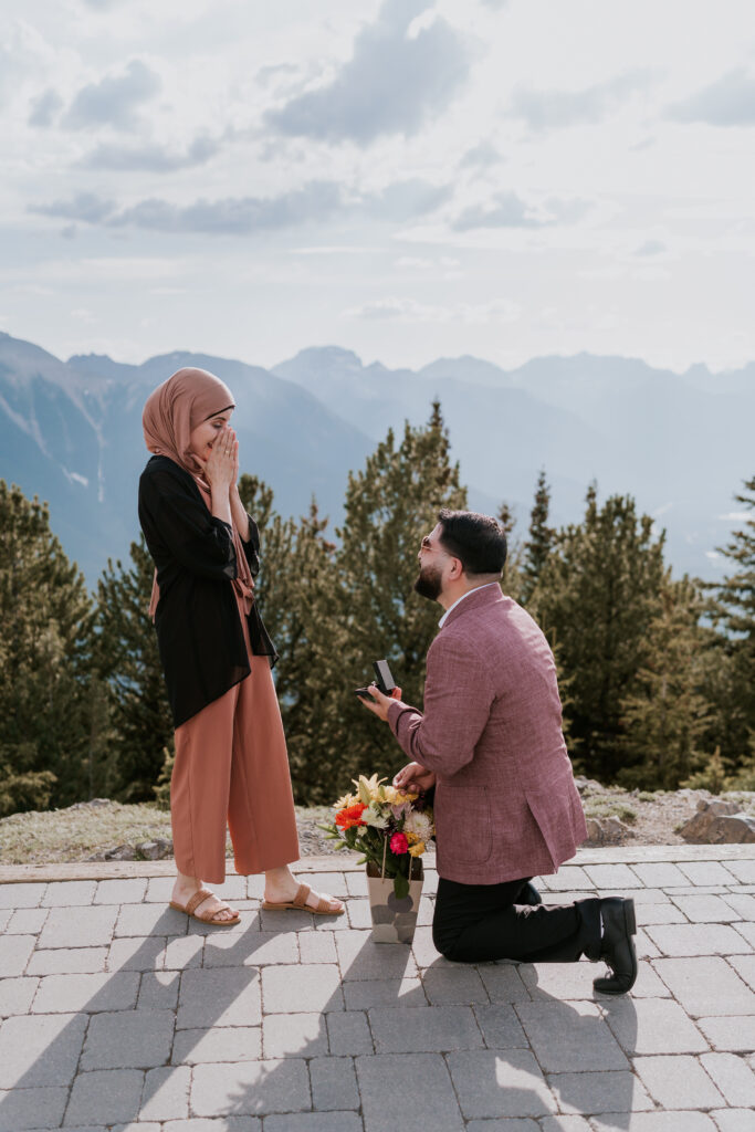 man proposes to his girlfriend on top of the banff gondola