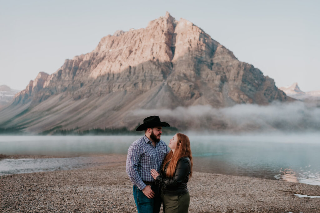 bow lake engagement photos after couple gets engaged at sunrise