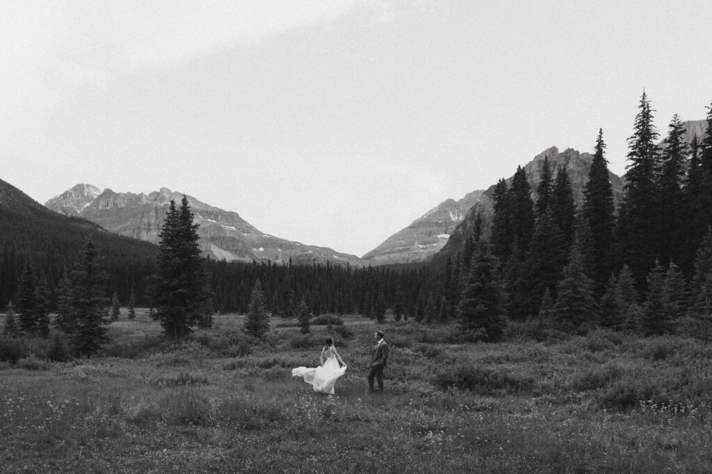 Couple dances in field during Shadow Lake Lodge elopement