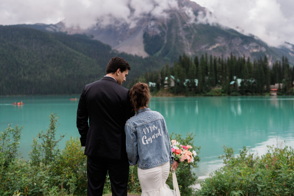 custom rhinestone elopement jean jacket on bride during emerald lake elopement