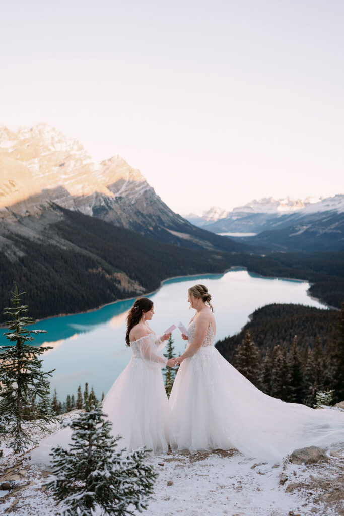 two brides exchange vows during sunrise ceremony at peyto lake