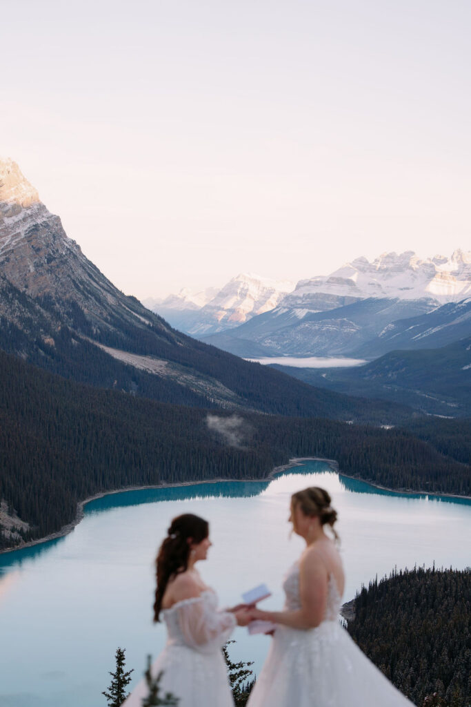 brides exchange vows overlooking peyto lake