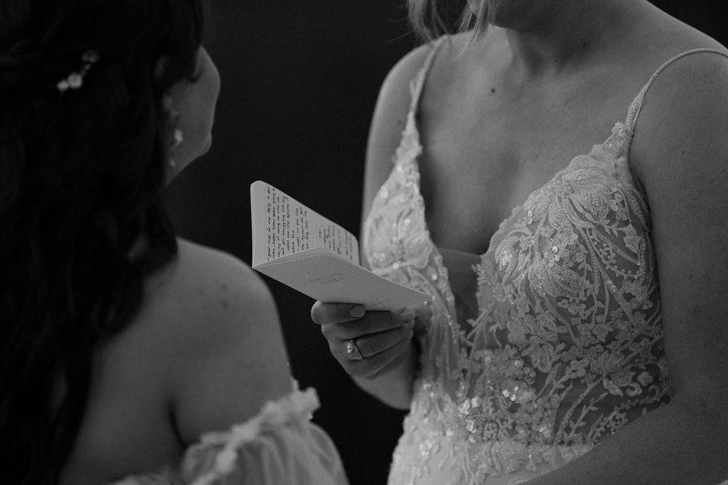 vow book close up during lesbian elopement ceremony in banff