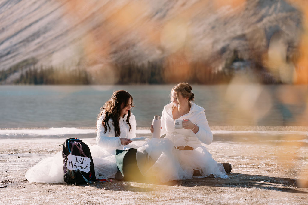 brides pour coffee into mugs during banff elopement