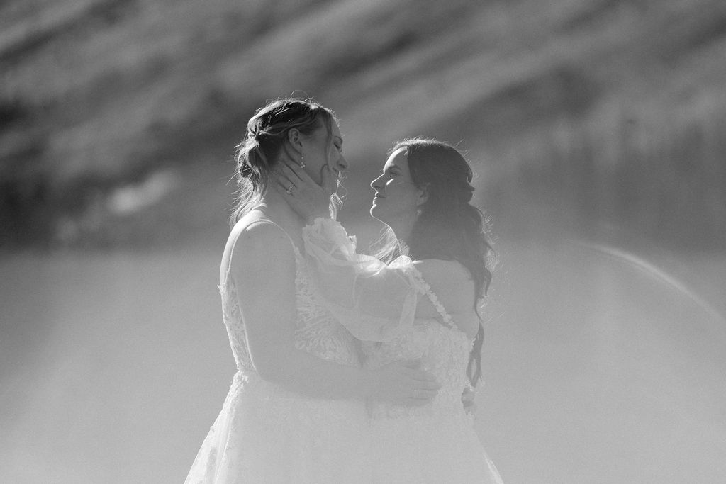  brides hold each other during elopement