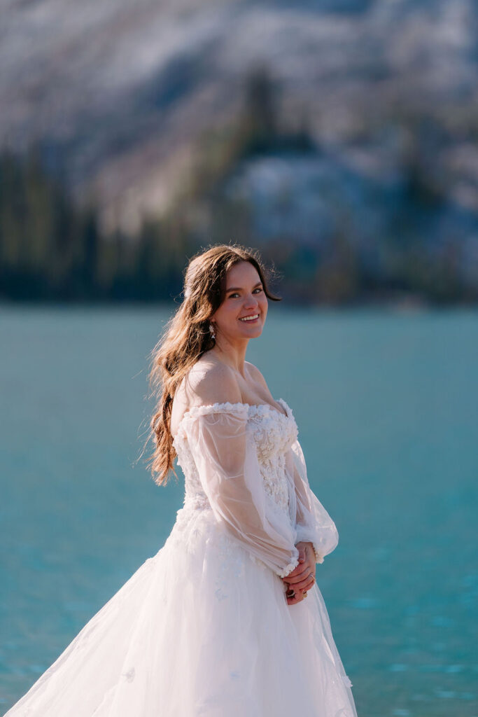 Bride in dress with puffy sleeves in Banff National Park