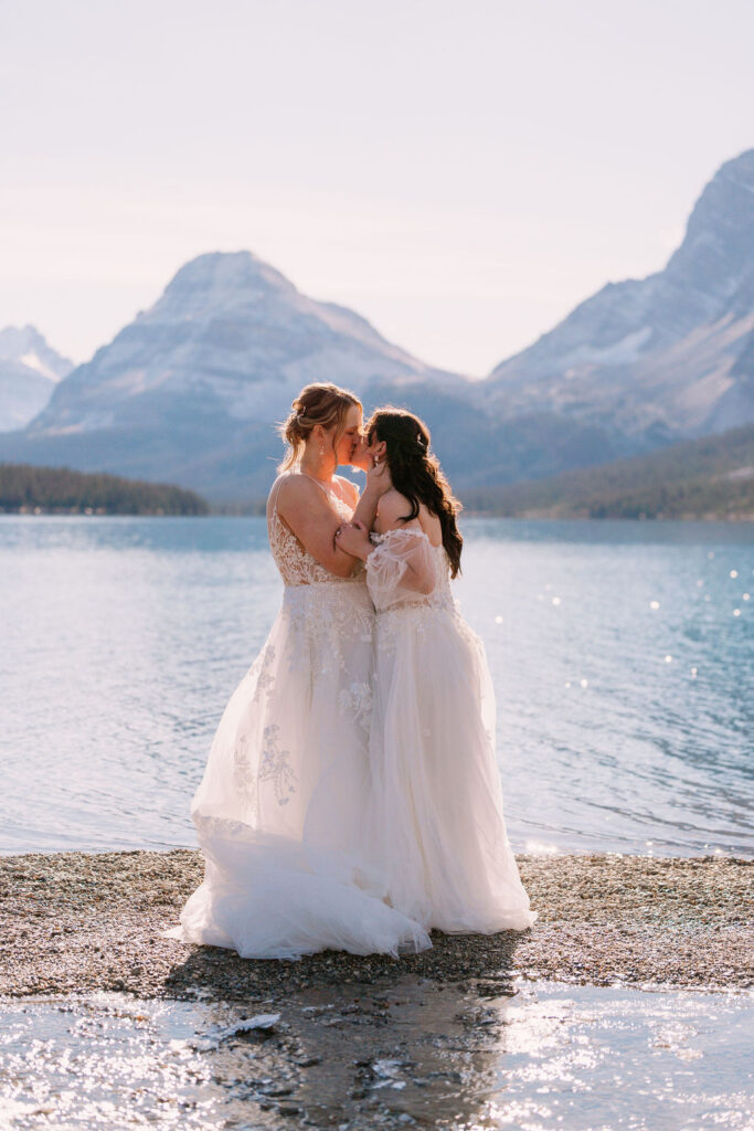 Brides kiss at Bow Lake
