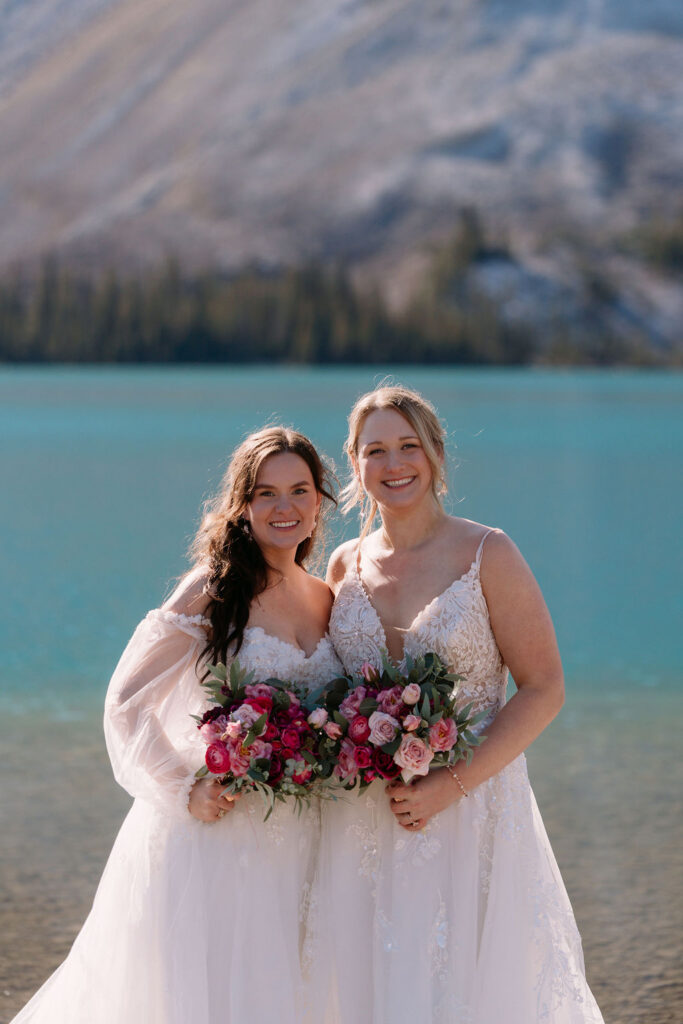 Brides look towards camera during sunrise October Banff elopement