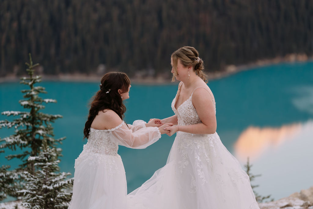 first look between brides at sunrise peyto lake elopement
