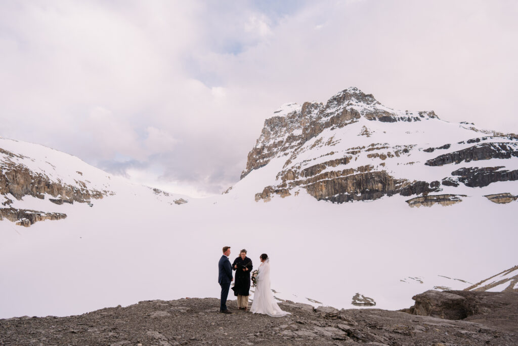 mountaintop ceremony in may with snow in the canadian rockies
